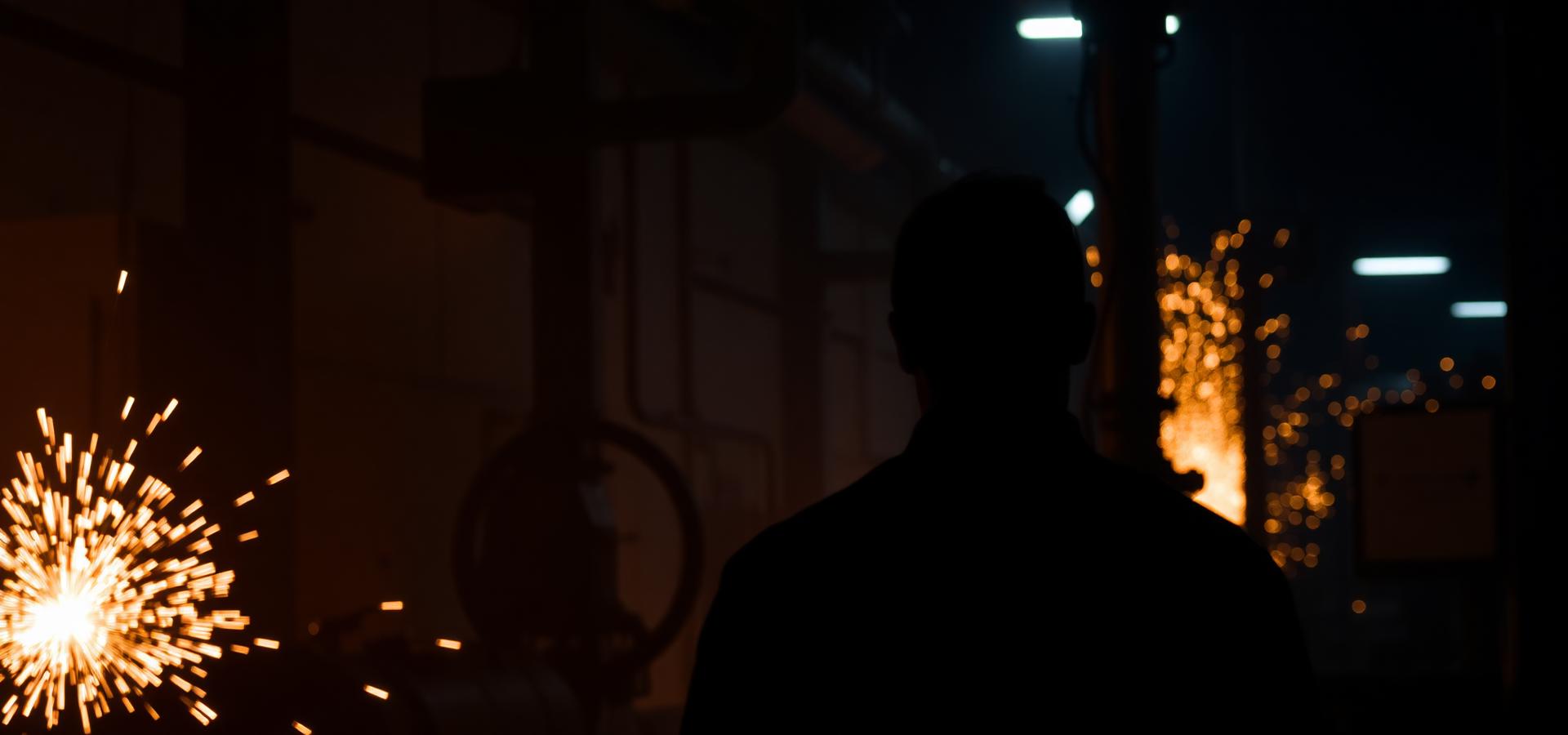 Industrial worker with sparks